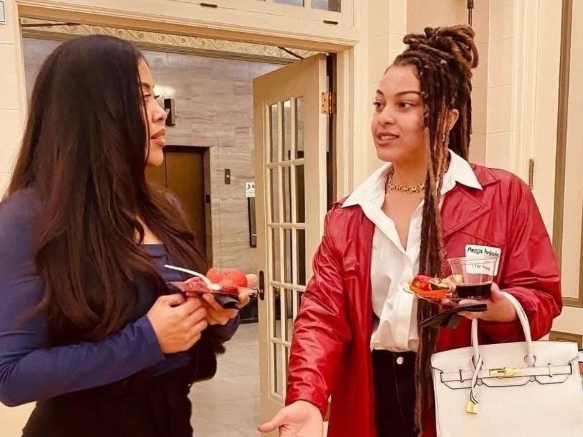 Two women in conversation at a U.S. Green Building Council event